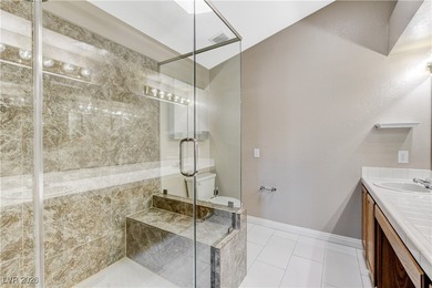 This 2-story home is located in Painted Desert, a guard-gated on Painted Desert Golf Club in Nevada - for sale on GolfHomes.com, golf home, golf lot