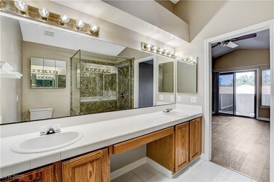 This 2-story home is located in Painted Desert, a guard-gated on Painted Desert Golf Club in Nevada - for sale on GolfHomes.com, golf home, golf lot