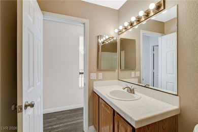 This 2-story home is located in Painted Desert, a guard-gated on Painted Desert Golf Club in Nevada - for sale on GolfHomes.com, golf home, golf lot