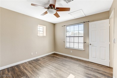 This 2-story home is located in Painted Desert, a guard-gated on Painted Desert Golf Club in Nevada - for sale on GolfHomes.com, golf home, golf lot