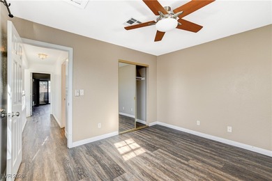 This 2-story home is located in Painted Desert, a guard-gated on Painted Desert Golf Club in Nevada - for sale on GolfHomes.com, golf home, golf lot