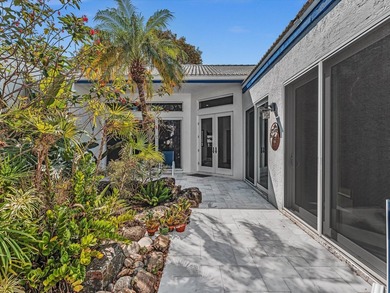 Experience the best of Florida living in this elegant courtyard on The Boca Country Club in Florida - for sale on GolfHomes.com, golf home, golf lot