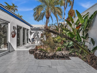 Experience the best of Florida living in this elegant courtyard on The Boca Country Club in Florida - for sale on GolfHomes.com, golf home, golf lot