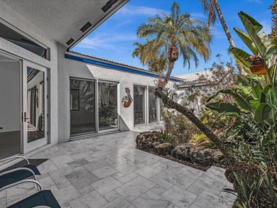 Experience the best of Florida living in this elegant courtyard on The Boca Country Club in Florida - for sale on GolfHomes.com, golf home, golf lot