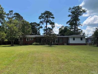 Waterfront Star Lake with convenient golf cart access to on Pensacola Country Club in Florida - for sale on GolfHomes.com, golf home, golf lot