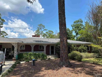 Waterfront Star Lake with convenient golf cart access to on Pensacola Country Club in Florida - for sale on GolfHomes.com, golf home, golf lot