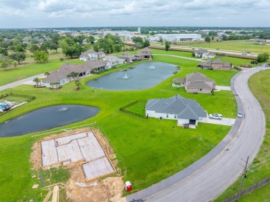 Lakeside living located in the exclusive, gated community of Le on LeTriomphe Golf and Country Club in Louisiana - for sale on GolfHomes.com, golf home, golf lot