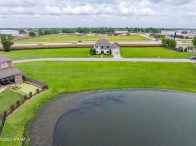 Experience lakeside living in the exclusive, gated community of on LeTriomphe Golf and Country Club in Louisiana - for sale on GolfHomes.com, golf home, golf lot