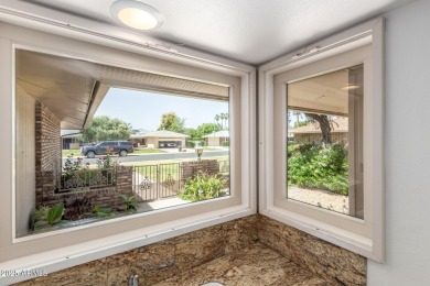 Welcome to this delightful home situated on a quiet, tree-lined on PalmBrook Country Club in Arizona - for sale on GolfHomes.com, golf home, golf lot
