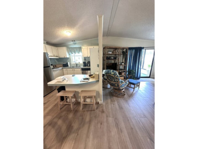 Discover this adorable and meticulously cared-for 2-bedroom home on Schalamar Creek Golf and Country Club in Florida - for sale on GolfHomes.com, golf home, golf lot