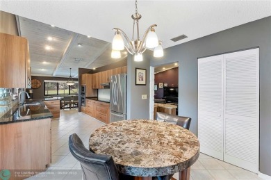 Move-In Ready Updated Immaculate 3-Bedroom, 2.5-Bath Pool Home on Woodmont Country Club in Florida - for sale on GolfHomes.com, golf home, golf lot