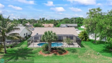 Move-In Ready Updated Immaculate 3-Bedroom, 2.5-Bath Pool Home on Woodmont Country Club in Florida - for sale on GolfHomes.com, golf home, golf lot