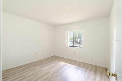 Charming 2-bed/2-bath Condo with Florida Room in Hudson! on Beacon Woods Golf Club in Florida - for sale on GolfHomes.com, golf home, golf lot