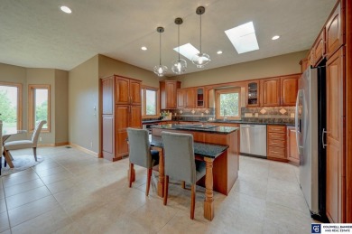 Indulge in luxury at this elegant ranch-style home in the on Wilderness Ridge Golf Club in Nebraska - for sale on GolfHomes.com, golf home, golf lot