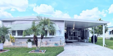 WELCOME TO YOUR NEW FLORIDA HOME WITH CARE-FREE LIVING!  This on Grasslands Golf and Country Club in Florida - for sale on GolfHomes.com, golf home, golf lot