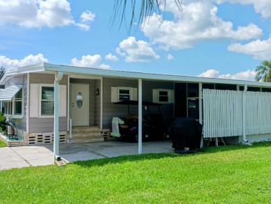 WELCOME TO YOUR NEW FLORIDA HOME WITH CARE-FREE LIVING!  This on Grasslands Golf and Country Club in Florida - for sale on GolfHomes.com, golf home, golf lot