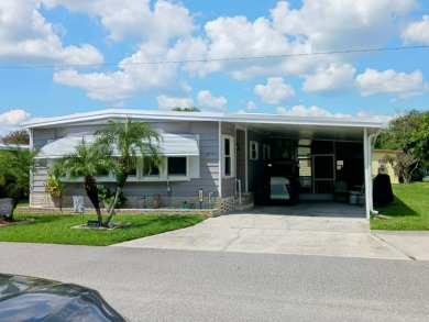 WELCOME TO YOUR NEW FLORIDA HOME WITH CARE-FREE LIVING!  This on Grasslands Golf and Country Club in Florida - for sale on GolfHomes.com, golf home, golf lot