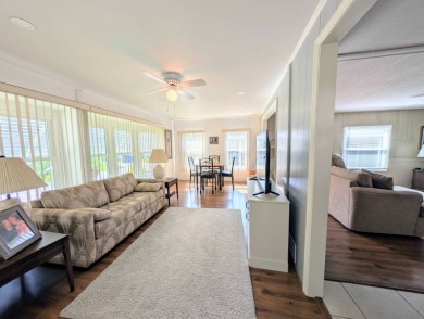 WELCOME TO YOUR NEW FLORIDA HOME WITH CARE-FREE LIVING!  This on Grasslands Golf and Country Club in Florida - for sale on GolfHomes.com, golf home, golf lot
