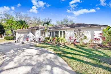 Nestled on a desirable corner lot in Feather Sound, this fully on Feather Sound Country Club in Florida - for sale on GolfHomes.com, golf home, golf lot