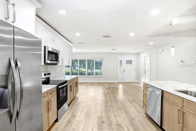 Nestled on a desirable corner lot in Feather Sound, this fully on Feather Sound Country Club in Florida - for sale on GolfHomes.com, golf home, golf lot