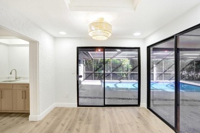 Nestled on a desirable corner lot in Feather Sound, this fully on Feather Sound Country Club in Florida - for sale on GolfHomes.com, golf home, golf lot