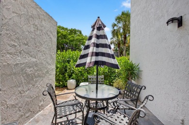 A picture says 1000 words. Elegantly renovated end unit with on Boca Lago Golf and Country Club in Florida - for sale on GolfHomes.com, golf home, golf lot
