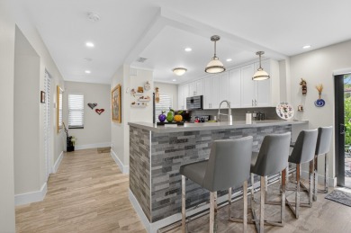 A picture says 1000 words. Elegantly renovated end unit with on Boca Lago Golf and Country Club in Florida - for sale on GolfHomes.com, golf home, golf lot