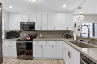 A picture says 1000 words. Elegantly renovated end unit with on Boca Lago Golf and Country Club in Florida - for sale on GolfHomes.com, golf home, golf lot