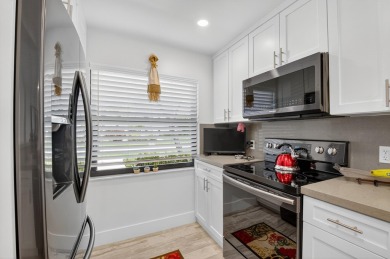 A picture says 1000 words. Elegantly renovated end unit with on Boca Lago Golf and Country Club in Florida - for sale on GolfHomes.com, golf home, golf lot
