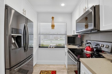 A picture says 1000 words. Elegantly renovated end unit with on Boca Lago Golf and Country Club in Florida - for sale on GolfHomes.com, golf home, golf lot