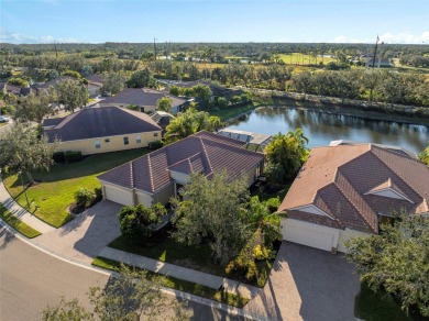 Discover Florida living in this stunning 4-bedroom, 3-bathroom on River Strand Golf and Country Club At Heritage Harbour  in Florida - for sale on GolfHomes.com, golf home, golf lot