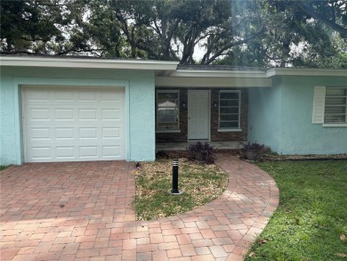 Welcome to this spacious move in ready home in one of the best on The Dunedin Country Club in Florida - for sale on GolfHomes.com, golf home, golf lot