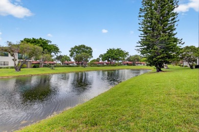 A picture says 1000 words. Elegantly renovated end unit with on Boca Lago Golf and Country Club in Florida - for sale on GolfHomes.com, golf home, golf lot