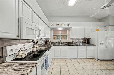 BOND PAID!!!  POOL HOME!!! A true tropical oasis awaits in this on Hacienda Hills Golf and Country Club in Florida - for sale on GolfHomes.com, golf home, golf lot