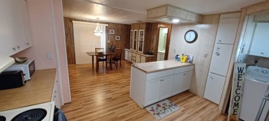 Come settle down and relax in a beautiful, manufactured home on Fairways Country Club in Florida - for sale on GolfHomes.com, golf home, golf lot