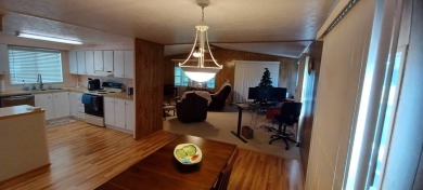 Come settle down and relax in a beautiful, manufactured home on Fairways Country Club in Florida - for sale on GolfHomes.com, golf home, golf lot