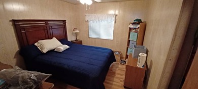 Come settle down and relax in a beautiful, manufactured home on Fairways Country Club in Florida - for sale on GolfHomes.com, golf home, golf lot