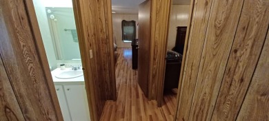 Come settle down and relax in a beautiful, manufactured home on Fairways Country Club in Florida - for sale on GolfHomes.com, golf home, golf lot