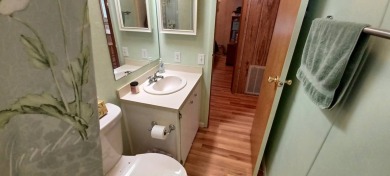 Come settle down and relax in a beautiful, manufactured home on Fairways Country Club in Florida - for sale on GolfHomes.com, golf home, golf lot
