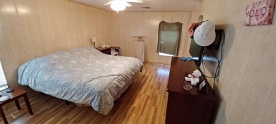Come settle down and relax in a beautiful, manufactured home on Fairways Country Club in Florida - for sale on GolfHomes.com, golf home, golf lot