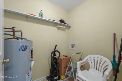 Discover easy coastal living in this desirable 2-bedroom, 2-bath on Oyster Bay Golf Links in North Carolina - for sale on GolfHomes.com, golf home, golf lot