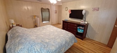 Come settle down and relax in a beautiful, manufactured home on Fairways Country Club in Florida - for sale on GolfHomes.com, golf home, golf lot