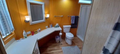 Come settle down and relax in a beautiful, manufactured home on Fairways Country Club in Florida - for sale on GolfHomes.com, golf home, golf lot