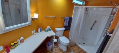 Come settle down and relax in a beautiful, manufactured home on Fairways Country Club in Florida - for sale on GolfHomes.com, golf home, golf lot