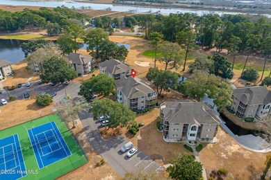 Discover easy coastal living in this desirable 2-bedroom, 2-bath on Oyster Bay Golf Links in North Carolina - for sale on GolfHomes.com, golf home, golf lot