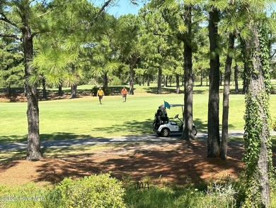 Discover easy coastal living in this desirable 2-bedroom, 2-bath on Oyster Bay Golf Links in North Carolina - for sale on GolfHomes.com, golf home, golf lot