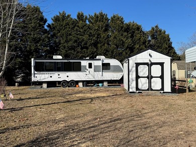 This is a rare treat.  Brand New 2025 Wildwood camper.  Just on Captains Cove Golf and Yacht Club in Virginia - for sale on GolfHomes.com, golf home, golf lot