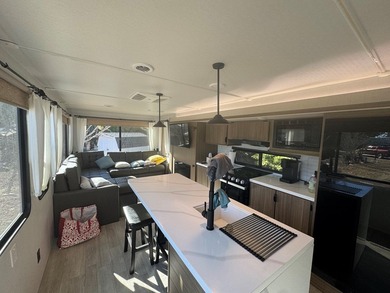 This is a rare treat.  Brand New 2025 Wildwood camper.  Just on Captains Cove Golf and Yacht Club in Virginia - for sale on GolfHomes.com, golf home, golf lot