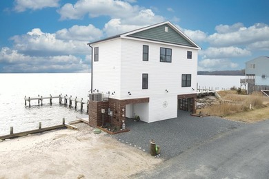 Tucked along the peaceful waters of Chincoteague Bay, this on Captains Cove Golf and Yacht Club in Virginia - for sale on GolfHomes.com, golf home, golf lot