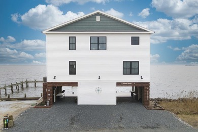 Tucked along the peaceful waters of Chincoteague Bay, this on Captains Cove Golf and Yacht Club in Virginia - for sale on GolfHomes.com, golf home, golf lot